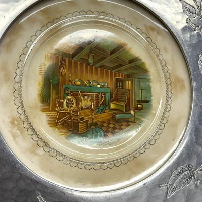 Sale Photo Thumbnail #774: Farberware Brooklyn NY Wrought Aluminum & Ceramic Center Plate with Cabin Scene
Approx. 16" across, 1940s-50s; Americana. Some crazing on plate and age discoloration.