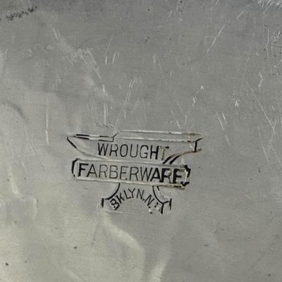 Sale Photo Thumbnail #776: Farberware Brooklyn NY Wrought Aluminum & Ceramic Center Plate with Cabin Scene
Approx. 16" across, 1940s-50s; Americana. Some crazing on plate and age discoloration.