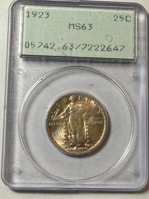 PCGS CERTIFIED RATTLER 1923-P MS63 GOLDEN TONED STANDING LIBERTY QUARTER AS PICTURED.