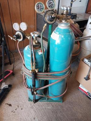 TWO TANKS WITH GAUGES ON PULL STAND