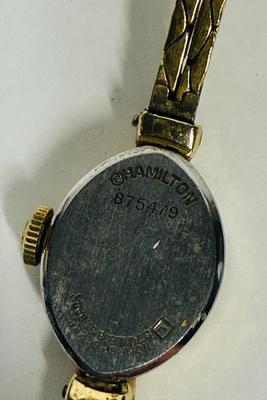 Sale Photo Thumbnail #60: Model 875479.  1980s Hamilton 1/20 10k gold filled Marquise case Ladies Watch. Very good condition. Gold Filled Double Rope Bracelet. Manual winder, watch is running.