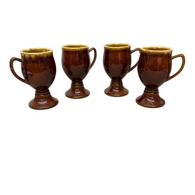 Sale Photo Thumbnail #916: 4 Hull Pottery Tall Brown Stemmed Mugs - one has chip on base as shown in photo