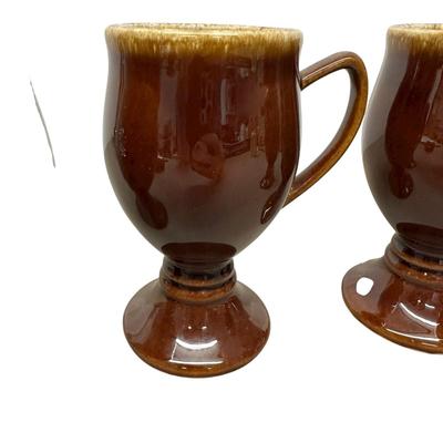 Sale Photo Thumbnail #917: 4 Hull Pottery Tall Brown Stemmed Mugs - one has chip on base as shown in photo