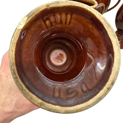 Sale Photo Thumbnail #919: 4 Hull Pottery Tall Brown Stemmed Mugs - one has chip on base as shown in photo