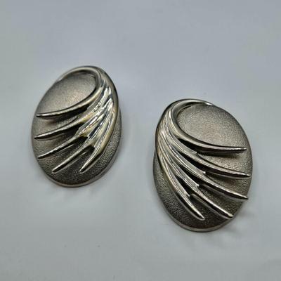 LOT 93: Multiple Pairs of Clip Earrings, Brooches, Silver-tone Chain with Winter Charms, and More