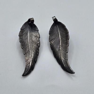 LOT 93: Multiple Pairs of Clip Earrings, Brooches, Silver-tone Chain with Winter Charms, and More