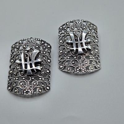 LOT 93: Multiple Pairs of Clip Earrings, Brooches, Silver-tone Chain with Winter Charms, and More
