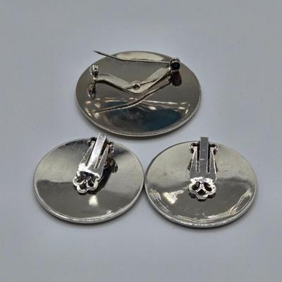 LOT 93: Multiple Pairs of Clip Earrings, Brooches, Silver-tone Chain with Winter Charms, and More
