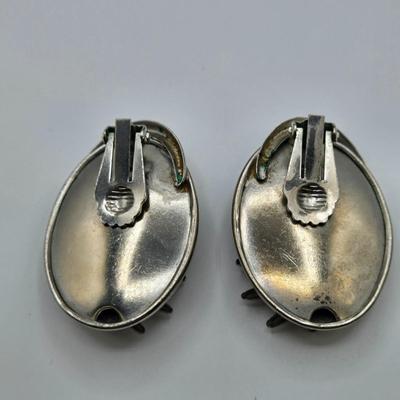 LOT 93: Multiple Pairs of Clip Earrings, Brooches, Silver-tone Chain with Winter Charms, and More