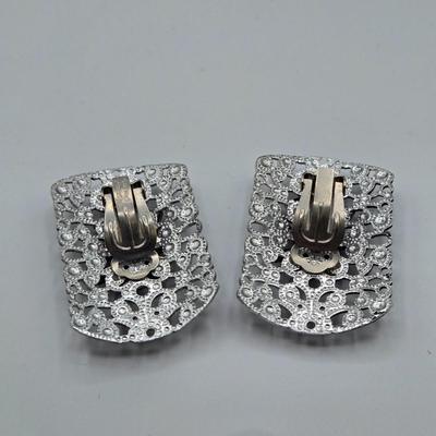 LOT 93: Multiple Pairs of Clip Earrings, Brooches, Silver-tone Chain with Winter Charms, and More