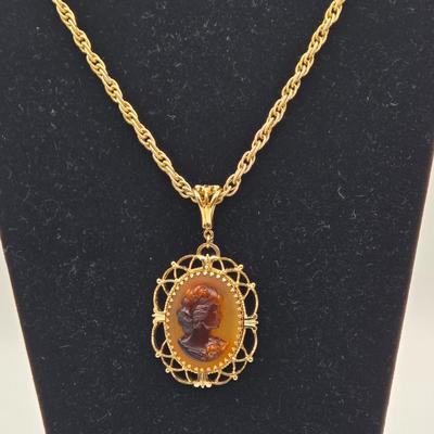 LOT 99: Multiple Gold-tone Necklaces and Chains and Pair of Earrings