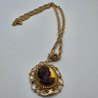 LOT 99: Multiple Gold-tone Necklaces and Chains and Pair of Earrings