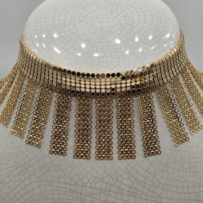 LOT 115: Gold-tone Choker Necklace, Clip Earrings, Pierced Earrings and Coil Watch Bracelet