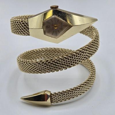 LOT 115: Gold-tone Choker Necklace, Clip Earrings, Pierced Earrings and Coil Watch Bracelet