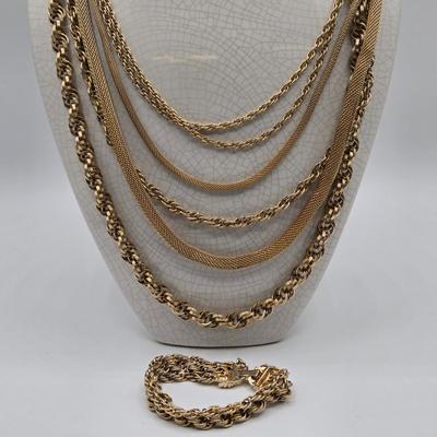 LOT 116: Gold-tone Multi Strand Necklace with Fringe, Multi Strand Necklace with Matching Bracelet, and Gold-tone Chain with Knot Charm