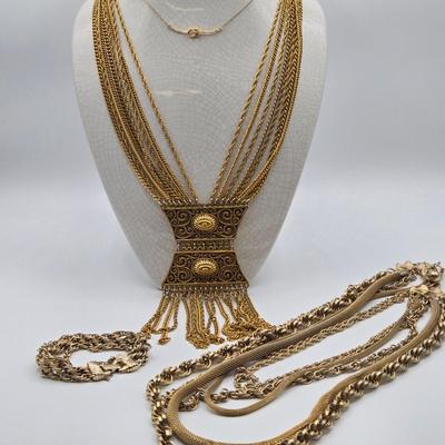 LOT 116: Gold-tone Multi Strand Necklace with Fringe, Multi Strand Necklace with Matching Bracelet, and Gold-tone Chain with Knot Charm