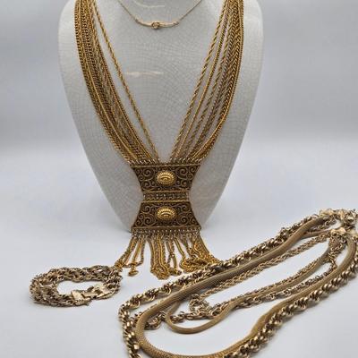 LOT 116: Gold-tone Multi Strand Necklace with Fringe, Multi Strand Necklace with Matching Bracelet, and Gold-tone Chain with Knot Charm