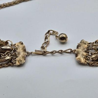 LOT 116: Gold-tone Multi Strand Necklace with Fringe, Multi Strand Necklace with Matching Bracelet, and Gold-tone Chain with Knot Charm