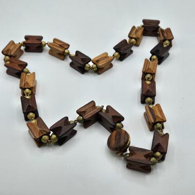 LOT 117: Multiple Wood-tone Necklaces and Clip Earrings