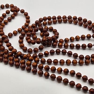LOT 117: Multiple Wood-tone Necklaces and Clip Earrings