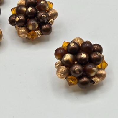 LOT 117: Multiple Wood-tone Necklaces and Clip Earrings