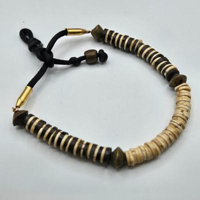 LOT 117: Multiple Wood-tone Necklaces and Clip Earrings