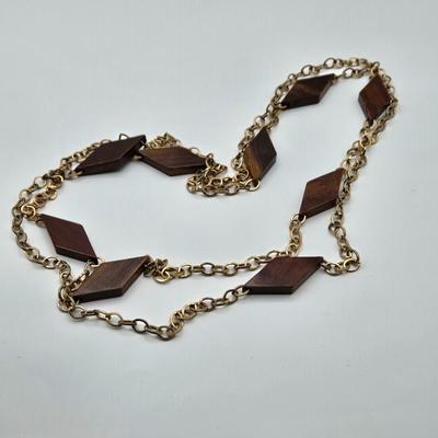 LOT 117: Multiple Wood-tone Necklaces and Clip Earrings
