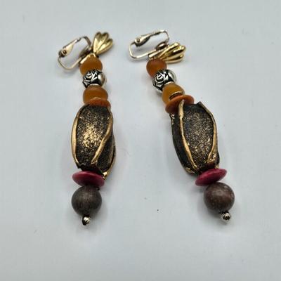 LOT 117: Multiple Wood-tone Necklaces and Clip Earrings
