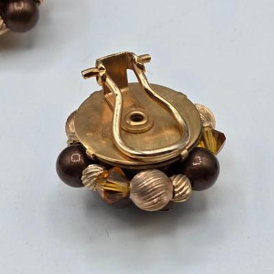 LOT 117: Multiple Wood-tone Necklaces and Clip Earrings