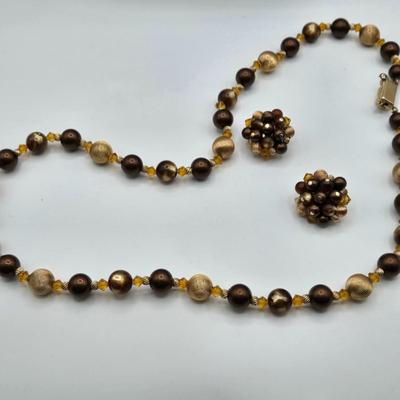 LOT 117: Multiple Wood-tone Necklaces and Clip Earrings