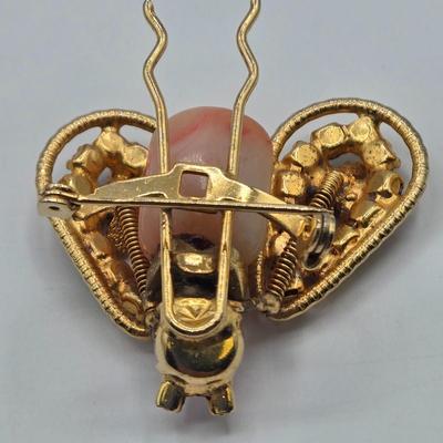 LOT 120: Fashionable Hair Combs, Barrett, Brooches with Matching Clip Earrings, and More