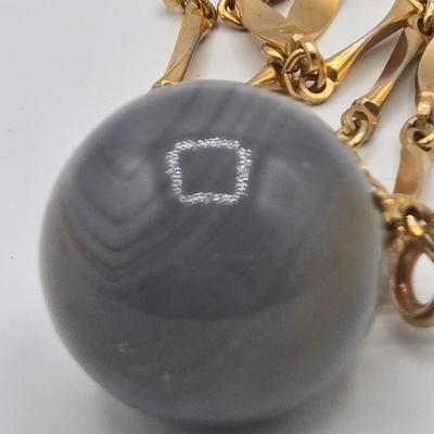 LOT 139: Two Round Polished Agate Pendants on Gold-tone Chains