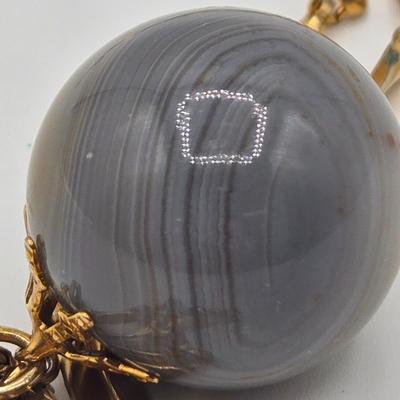 LOT 139: Two Round Polished Agate Pendants on Gold-tone Chains