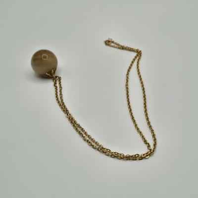 LOT 139: Two Round Polished Agate Pendants on Gold-tone Chains