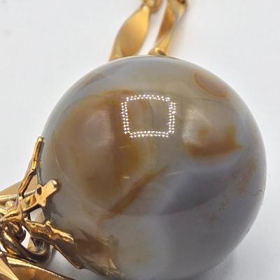 LOT 139: Two Round Polished Agate Pendants on Gold-tone Chains
