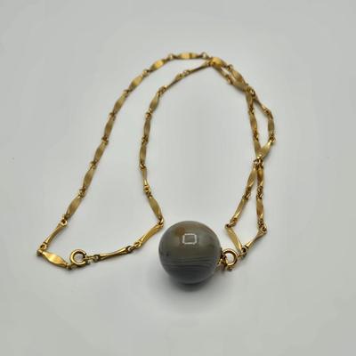 LOT 139: Two Round Polished Agate Pendants on Gold-tone Chains