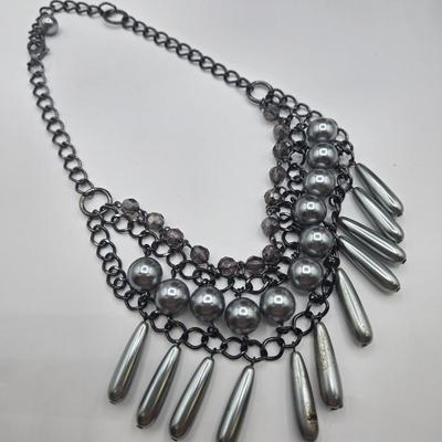 LOT 142: Multiple Pieces of Silver-tone Jewelry Including Rose Quartz Necklace, Lucite Block Necklace, Fun Turtle Necklace, and More