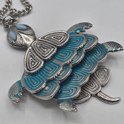 LOT 142: Multiple Pieces of Silver-tone Jewelry Including Rose Quartz Necklace, Lucite Block Necklace, Fun Turtle Necklace, and More
