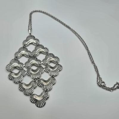 LOT 142: Multiple Pieces of Silver-tone Jewelry Including Rose Quartz Necklace, Lucite Block Necklace, Fun Turtle Necklace, and More
