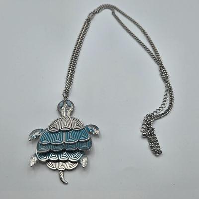 LOT 142: Multiple Pieces of Silver-tone Jewelry Including Rose Quartz Necklace, Lucite Block Necklace, Fun Turtle Necklace, and More