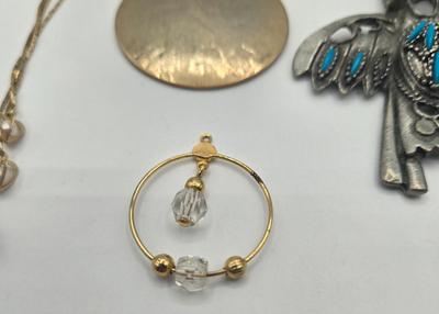 LOT 146: Numerous Gold-tone Chains, Variety of Charms & Pendants, and Three Pairs of Pierced Earrings
