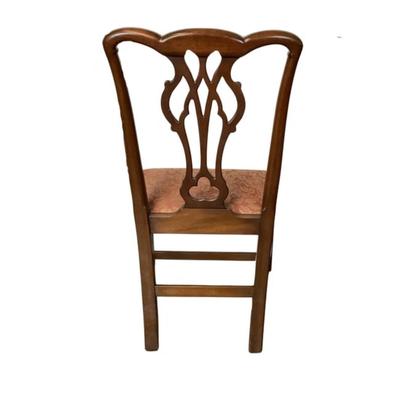 Sale Photo Thumbnail #1582: Kittinger Chippendale chairs are high-quality reproductions of 18th-century Chippendale furniture, known for their elegance and craftsmanship. These chairs are made by the Kittinger Furniture Company, which has a long history of producing fine furniture i