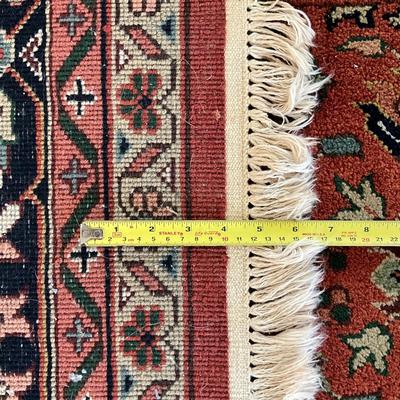 Sale Photo Thumbnail #1621: One end of the rug is sun faded. Rug isn't good condition other than the one side of fading. Measures 14 feet long by 9'10" wide.