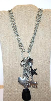 Marked "©bebe'' CHARMS NECKLACE with Elephant, Star, Hearts, Zebra, Bejeweled Black Ball & Oval and Lobster Clasp...