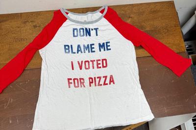 Sale Photo Thumbnail #331: Junior size L (11/13).  Used but in good condition.  Patriotic red-white-blue colors, printing on the from reads " Don't Blame Me I Voted For Pizza".