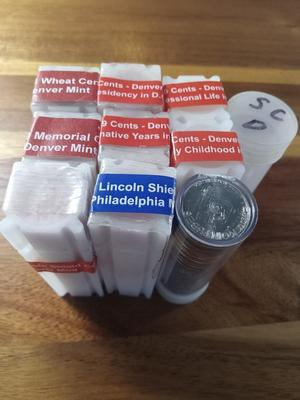 8 rolls of pennies and some nickles