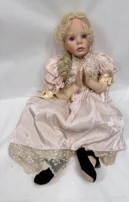 Sale Photo Thumbnail #240: In fair condition. Her hair is a little messy. Her hands have had velcro applied to hands to keep them together in prayer. She's wearing a vintage pearl necklace.