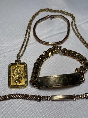 Sale Photo Thumbnail #85: Includes watchband, two bracelets, necklace, and pendant