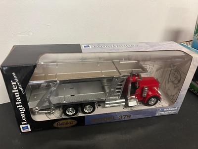LOT 121: Collection of Toy Trucks with Original Packaging - Mobil, Sunoco and More