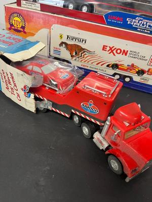 LOT 122: Collection of Toy Trucks with Original Packaging - Amoco, Exxon and More